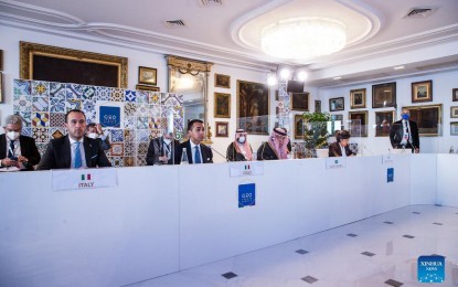 <p><strong>REINFORCING GLOBAL TRADE SYSTEM</strong>. Italian Foreign Minister Luigi Di Maio (2nd left, front) attends the G20 Trade and Investment Ministerial Meeting in Sorrento, southern Italy, on Oct. 12, 2021. Luigi Di Maio on Tuesday called on ministers from the Group of 20 (G20) to reinforce the global trade system through the World Trade Organization (WTO).<em> (G20 Italy/Handout via Xinhua)</em></p>