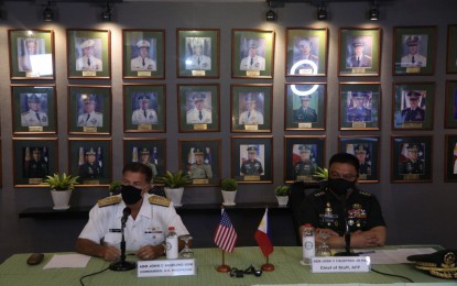 <p><strong>GOING FULL BLAST.</strong> AFP chief Gen. Jose Faustino Jr. (right) and US Indo-Pacific Command chief Adm. John Aquilino (left) hold a virtual presser on the sidelines of the Mutual Defense Board and Security Engagement Board meeting in Camp Aguinaldo on Thursday (Oct. 14, 2021). Faustino said the annual "Balikatan" exercises between the Philippines and United States will go full scale next year. <em>(Photo courtesy of AFP)</em></p>