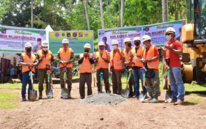 <p><strong>ROAD TO PEACE.</strong> Local government and military officials are shown in the photo during the opening prayer of the groundbreaking that signaled the start of the “road to peace” project in Barangay Kabbon Takas, Patikul, Sulu on Wednesday (Oct. 13, 2021). The village was a former stronghold of the Abu Sayyaf group. <em>(Photo courtesy of 11ID)</em></p>