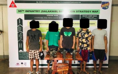 <p><strong>SURRENDERED</strong>. Five members of the New People’s Army surrendered together with three high-powered firearms in Ilagan City and Nueva Vizcaya on October 14 and 15, 2021. The surrenderers claimed they are tired of running and hiding from government forces. (<em>Photo courtesy of 5thID photo</em>)  </p>