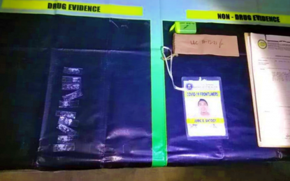 <p><strong>FRONT-LINER NO MORE</strong>. The shabu items and identification card seized from drug suspect Juric Batooy, a construction worker who doubles as an anti-Covid-19 front-liner at a quarantine checkpoint in Barangay Poblacion, Kidapawan City, after his arrest on Friday (Oct. 15, 2021). The suspect’s live-in partner, Christine Joy, is now the subject of a PDEA follow-up operation. <em>(Photo courtesy of PDEA-12)</em></p>