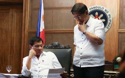 <p>President Rodrigo Duterte (left) and incoming Chief Presidential Legal Counsel Jesus Melchor Quitain (right). <em>(Presidential photo)</em></p>