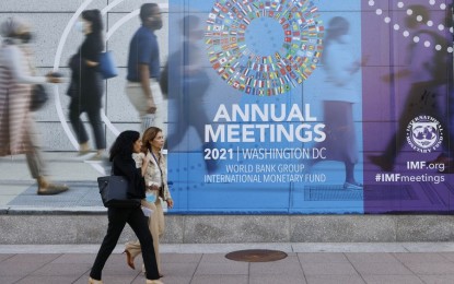 <p><strong>GROWTH FORECAST. </strong>People walk past the International Monetary Fund (IMF) headquarters in Washington, D.C., the United States on Oct. 14, 2021. The IMF on Tuesday (Oct. 19) revised down its 2021 economic growth forecast for Asia to 6.5 percent, down by 1.1 percentage points from its April projection.<em> (Photo by Ting Shen/Xinhua)</em></p>