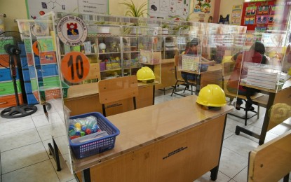 <p><strong>BARRIERS FOR PROTECTION.</strong> Acrylic barriers are installed on each desk at the Aurora A. Quezon Elementary School in Manila in preparation for possible inclusion in face-to-face classes. Despite the retrofitting of classrooms to ensure safety against Covid-19, not all parents are comfortable in sending their children back to school as limited face-to-face classes begin in select institutions on Nov. 15, 2021. <em>(Photo courtesy of Manila PIO)</em></p>