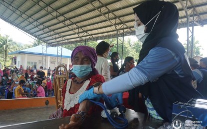 <p><strong>IP SERVICE.</strong> An elderly woman in Barangay Patot, Pigcawayan, North Cotabato receives medical services from the Bangsamoro Autonomous Region in Muslim Mindanao (BARMM) during an outreach program on Friday (Oct. 22, 2021). The Ministry of Indigenous Peoples’ Affairs said that other BARMM communities in North Cotabato will receive the same services soon. <em>(Photo courtesy of Bangsamoro Information Office-BARMM)</em></p>