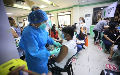 <p><strong>FOR KIDS ONLY.</strong> Children with comorbidities aged 12 to 17 receive their coronavirus disease 2019 vaccine shots at Las Piñas General Hospital on Friday (Oct. 22, 2021). Only Moderna and Pfizer jabs are being administered for now to the minors. <em>(PNA photo by Avito Dalan)</em></p>