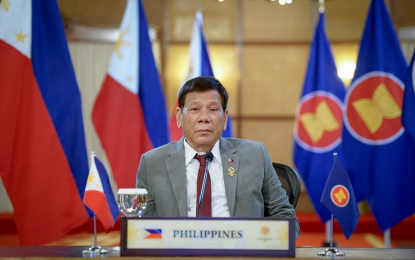 <p><strong>ASEAN SUMMITS</strong>. President Rodrigo Roa Duterte delivers his remarks at the virtual 38th and 39th Association of Southeast Asian Nations (Asean) Summits and Related Summits hosted by Brunei Darussalam at the Malacañang Palace on Tuesday (Oct. 26, 2021). Duterte is accompanied by some members of his Cabinet.<em> (Presidential photo by King Rodriguez)</em></p>