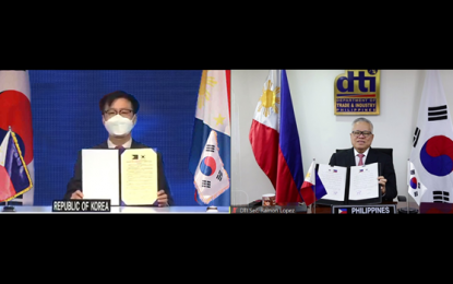 <p>DTI Secretary Ramon Lopez (right) and South Korea's Trade, Industry and Energy Minister Yeo Han-Koo (left) <em>(Screengrab from virtual ceremony)</em></p>