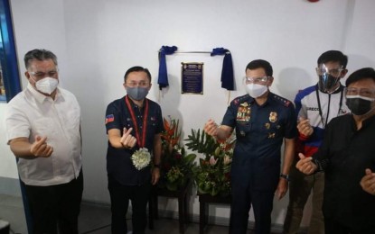 <p><strong>MALASAKIT CENTER.</strong> PNP chief Gen. Guillermo Eleazar (3rd from right) and Senator Christopher "Bong" Go (2nd from left) do a "finger heart" gesture during the launch of the PNP Malasakit Center in Camp Crame on Monday (Oct. 25, 2021). The Malasakit Center will provide accessible frontline services and assistance to members of the police force and their dependents. <em>(Photo courtesy of PNP)</em></p>
