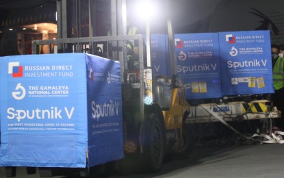 <p><strong>RUSSIAN PROTECTION.</strong> Boxes containing 400,000 doses of Sputnik V Covid-19 jabs are transferred to a cold storage truck at the Ninoy Aquino International Airport Terminal 3 on Oct. 21, 2021. The Philippines is already planning to administer booster shots to health care workers, elderly, and adults with comorbidities.<em> (PNA photo by Avito Dalan)</em></p>