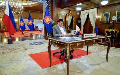 <p><strong>PEACE IN KOREAN PENINSULA.</strong> President Rodrigo Roa Duterte skims through a document as he attends the plenary proceedings of the virtual 38th and 39th Association of Southeast Asian Nations (ASEAN) Summits and Related Summits hosted by Brunei Darussalam at the Malacañang Palace on Oct. 26, 2021. Duterte has renewed his call to fellow Asean leaders to hold continued talks to bring peace in the Korean Peninsula.<em> (Presidential photo by King Rodriguez)</em></p>