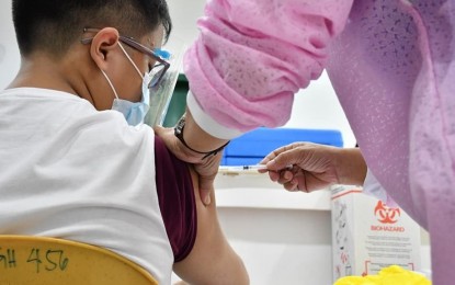 <p><strong>PROTECTION.</strong> Sixteen-year-old Gabby Uy receives the Covid-19 vaccine at the JR Borja General Hospital in Cagayan de Oro City. The local government on Friday (Oct. 29, 2021) began inoculating minors aged 12 to 17. <em>(Photo courtesy of CIO)</em></p>