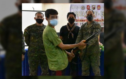 <p><strong>ASG SURRENDERERS.</strong> Ten members of the Abu Sayyaf Group (ASG) surrender to government authorities Thursday (Oct. 28, 2021) in Talipao, Sulu. Maj. Gen. William Gonzales, Joint Task Force (JTF)-Sulu commander (right), received a Garand rifle yielded by one of the surrenderers. <em>(Photo courtesy of JTF-Sulu Public Affairs Office)</em></p>
<p> </p>