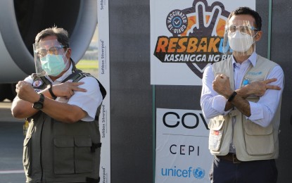 <p><strong>SHIPMENT.</strong> Dr. Teodoro Herbosa (left), National Task Force Against Covid-19 special medical adviser, and Behzad Noubary, UNICEF deputy representative, witness the arrival of 1,546,200 doses of the AstraZeneca Covid-19 vaccine at the Ninoy Aquino International Airport Terminal 3 on Saturday (Oct. 30, 2021). Herbosa said he is confident the country can achieve population protection this year. <em>(Photo courtesy of NTF)</em></p>
