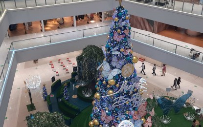 <p><strong>MERRIER CHRISTMAS.</strong> A Christmas tree adorned with blue and gold balls and butterfly-shaped decors stands at the center of a mall in Mandaluyong City in this undated photo. Despite the easing of quarantine restrictions which have resulted in increased mobility and economic activities, some Filipinos opt to take extra precaution even after getting vaccinated to help the country sustain its momentum in keeping the Covid-19 situation under control. <em>(Contributed photo)</em></p>