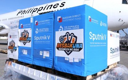 <p><strong>RUSSIAN JABS ARRIVE.</strong> Philippine Airlines Flight PR8623 arrives with 2.7 million doses of Sputnik V vaccines at the Ninoy Aquino International Airport Terminal 2 on Tuesday afternoon (Nov. 2, 2021). The shipment is the biggest delivery so far by Russia’s Gamaleya Research Institute.<em> (PNA photo by Joey Razon)</em></p>