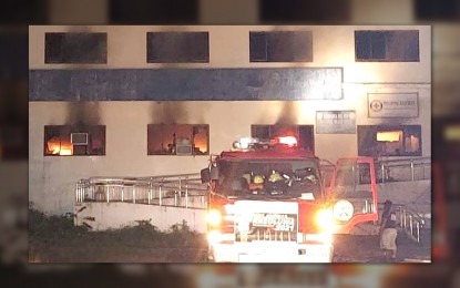 <p><strong>UP IN SMOKE.</strong> Fire hits the Provincial Health Office of Zamboanga del Sur in Pagadian City on Sunday night (Oct. 31, 2021). The National Task Force Against Covid-19 and other concerned agencies said they will replace the 148,678 doses of Covid-19 vaccines destroyed.<em> (Photo courtesy of Victory Zamboanga del Sur)</em></p>