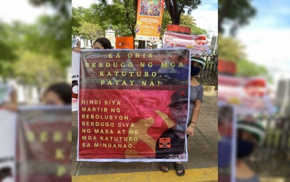 <p><strong>BERDUGO, NOT MARTYR</strong>. Members of anti-communist groups refer to slain NPA leader Jorge Madlos alias Ka Oris as a terrorist, not a revolutionary martyr, during a rally outside the Commission on Elections main office at the Palacio del Gobernador in Intramuros, Manila on Nov. 5. The groups also urged the disqualification of party-list groups Kabataan and Gabriela from the 2022 elections because of their links with the CPP-NPA-NDF. (<em>Contributed photo</em>)</p>