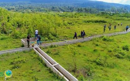 <p><strong>SOLAR-POWERED IRRIGATION.</strong> Officials of the Ministry of Agriculture, Fisheries and Agrarian Reform-Bangsamoro Autonomous Region in Muslim Mindanao and farmers inspect the lined canal of the newly-built solar-powered irrigation system that will benefit some 1,500 rice farmers in Butig and Sultan Dumalondong towns and make them more productive. The modern irrigation system has the capability of gathering 3.5 cubic meters of water per minute with 660-cubic meters that can supply water for 50-70 hectares of paddy fields. <em>(Photo courtesy of MAFAR-BARMM)</em></p>