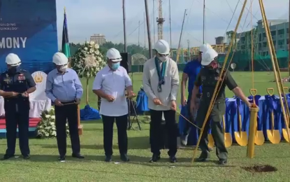 <p><strong>BREAKING GROUND.</strong> Officials of the Department of Transportation (DOTr), the Department of National Defense (DND), and other uniformed services during the ceremonial groundbreaking of the Metro Manila Subway Project’s (MMSP) Advanced Works Package 2 at Camp Aguinaldo in Quezon City on Thursday. DOTr Assistant Secretary Fidel Igmedio Cruz, Jr. said the advanced works package would replicate or improve DND-AFP structures and facilities that will be affected by the construction of MMSP buildings and facilities at Camp Aguinaldo. <em>(Screen capture of DOTr video)</em></p>