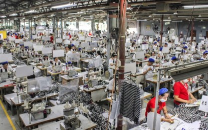 <p><strong>IMPROVED PRODUCTION</strong>. Employees work at a manufacturing plant in an economic zone in Cebu in this undated photo. S&P Global Manufacturing Purchasing Managers' Index reported on Tuesday (Jan. 2, 2023) that the country's manufacturing improved in December 2023, while growth was at a slower pace. <em>(Photo courtesy of MEPZ Workers Alliance)</em></p>