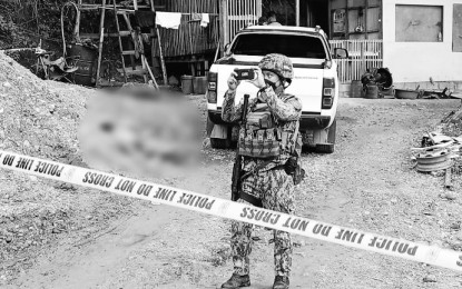 <p style="text-align: left;"><strong>CRIME SCENE.</strong> A police officer stands guard at the quarry site in Sitio Perico, Barangay Pagatpat, Cagayan de Oro City where Roland Sherwin Uy, a councilman of Barangay Carmen and son of 1st District Rep. and mayoralty candidate Rolando Uy, and a caretaker (lying on the ground) were shot dead on Thursday afternoon (Nov. 11, 2021). A special investigation task force has been formed to look into the incident. <em>(PNA photo by Jigger Jerusalem)</em></p>