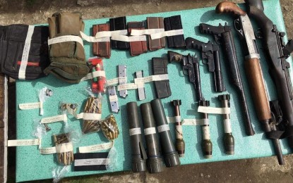 <p><strong>SEIZED.</strong> The seized guns and bullets from village chief Wilfredo Dueñas of Liwan Sur, Enrile town in Cagayan province on Friday (Nov. 12, 2021). Lt. Col. Efren Fernandez II, the newly installed police spokesperson in Cagayan Valley, said on Sunday (Nov. 14, 2021) the raid was witnessed by a village councilman. <em>(Photo courtesy of PNP-Enrile)</em></p>
