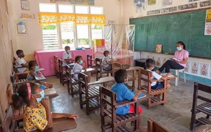 <p><strong>IN-PERSON CLASSES.</strong> Learners of Burgos Elementary School in Botolan, Zambales join the pilot implementation of face-to-face classes on Monday (Nov. 15, 2021). Some 100 public schools nationwide reopened to learners in a limited in-person setup, after more than a year of being shuttered due to the pandemic. <em>(Photo courtesy of DepEd)</em></p>