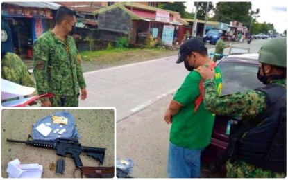 <p><strong>CAUGHT.</strong> Policemen arrest former Army soldier Akmad Manguda (in green T-shirt) for carrying an unlicensed Bushmaster rifle inside his vehicle in Pigcawayan, North Cotabato on Tuesday (Nov. 16, 2021). The suspect was detained at the Pigcawayan police station pending charges for illegal possession of firearms and ammunition. <em>(Photos courtesy of Koko Mario’s FB page)</em></p>