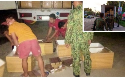 <p> </p>
<p><strong>CAUGHT.</strong> Military and police personnel manning a checkpoint in Aleosan, North Cotabato arrest three suspected smugglers who hid smuggled cigarettes inside polystyrene boxes declared as fish inside their van-type delivery truck on Sunday (Nov. 21, 2021). Almost PHP900,000 worth of smuggled cigarettes and an unlicensed .45-caliber pistol were seized from the suspects. <em>(Photo courtesy of PRO-12)</em></p>