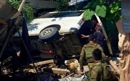 <p><strong>WAYWARD VAN.</strong> Police officers check on the passengers of a wayward van that plowed through a row of houses in Rajah Buayan, Maguindanao on Wednesday (Nov. 24, 2021). A construction worker sleeping inside the comfort of his home was killed in the incident. <em>(Photo courtesy of Rajah Buayan MRRMC)</em></p>