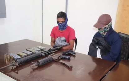 <p><strong>SURRENDERERS</strong>. The two members of the New People’s Army (NPA) who surrendered to soldiers of the 802nd Infantry Brigade on Nov. 24, 2021. The military said on Thursday (Nov. 25) they expect more rebels to yield to authorities. <em>(Photo courtesy of Philippine Army)</em></p>