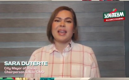 <p><strong>UNITEAM</strong>. Davao City Mayor Sara Z. Duterte delivers her message during the signing of an alliance agreement by four political parties at the Sofitel Philippine Plaza Hotel in Pasay City on Thursday (Nov. 25, 2021). Top officials of the Partido Federal ng Pilipinas, Lakas-CMD (Christian Muslim Democrats), Pwersa ng Masang Pilipino, and Hugpong ng Pagbabago signed the agreement for the “UniTeam” to support the candidacies of presidential aspirant Ferdinand Marcos Jr. and his running mate, Mayor Sara.<em> (Screenshot of the event)</em></p>