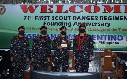 <p><strong>END REDS' THREAT.</strong> AFP chief, Lt. Gen. Andres Centino (wearing red garland) graces the 71st anniversary of the First Scout Ranger Regiment (FSSR) in Camp Pablo Tecson in San Miguel, Bulacan on Thursday (Nov. 25, 2021). Centino called on the FSRR and other elite military units to intensify operations against communist terrorists.<em> (Photo courtesy of AFP)</em></p>