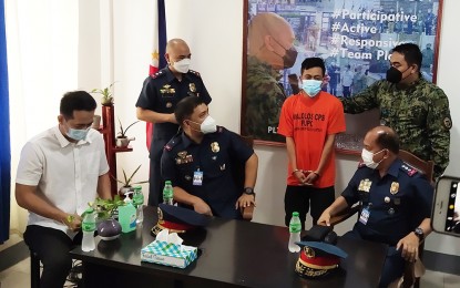 <p><strong>BUSTED.</strong> PRO-3 Regional Director Brig. Gen. Matthew Baccay Jr., (3rd from right, seated) interrogates drug suspect Abubakar Sandigan after his presentation to members of the local media on Friday afternoon (Nov. 26, 2021). Also in photo are (from left) Malolos City Mayor Gilbert Gatchalian, Lt. Col. Christopher Leano, Malolos City police chief, and Col. Manuel M. Lukban, acting Bulacan provincial director. <em>(Photo by Manny Balbin)</em></p>