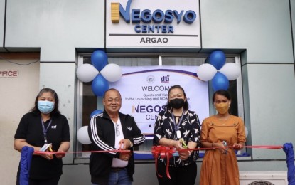 <p><strong>NEGOSYO CENTERS</strong>. DTI-Cebu provincial director Rose Mae Quiñanola (second from right) leads other officials in launching the 33rd Negosyo Center in Argao, Cebu on Friday (Nov. 26, 2021). The opening of Negosyo Center in Argao signals a positive growth as the municipality moves forward and rehabilitates MSMEs.<em> (Photo courtesy of DTI-Cebu)</em></p>