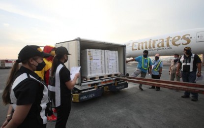 <p><strong>JUST ARRIVED.</strong> The Emirates flight carrying 547,100 doses of the AstraZeneca Covid-19 vaccine, donated by Poland, lands at the Ninoy Aquino International Airport Terminal 3 in Pasay City on Sunday (Nov. 28, 2021). It was the first vaccine donation from the Polish government. <em>(PNA photo by Avito Dalan)</em></p>
