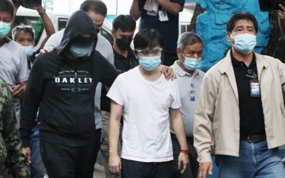 <p><strong>DETAINEES</strong>. For not submitting documents required by the Senate for an ongoing procurement probe, Pharmally Pharmaceutical Corporation executives Mohit Dargani (left, wearing a hoodie) and Linconn Ong (in white shirt) are transferred from the Senate to the Pasay City Jail on Nov. 29, 2021. Jail officials assured no special treatment for the duo. <em>(PNA photo by Avito Dalan)</em></p>