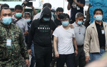 <p><strong>DETAINEES.</strong> For not submitting documents required by the Senate in an ongoing procurement probe, Pharmally Pharmaceutical Corporation executives Linconn Ong (in white shirt) and Mohit Dargani (in a hoodie) are transferred from the Senate to the Pasay City Jail on Monday (Nov. 29, 2021). Jail officials assured no special treatment for the duo. <em>(PNA photo by Avito Dalan)</em></p>