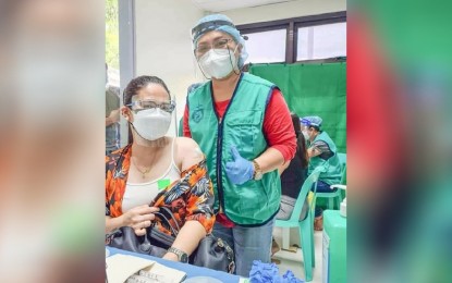 <p><strong>MODERN-DAY HEROES.</strong> Rosemarie Baguio, a Dabawenya, gets her first dose of the coronavirus disease 2019 vaccine on June 5, 2021, in Davao City. She said during a  pandemic, modern-day heroes could be anyone, from front-liners to people getting vaccinated. <em>(Photo courtesy of Rose Baguio)</em></p>