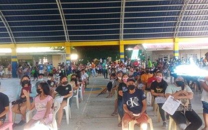 <p><strong>WAITING TO GET THE SHOT</strong>. Residents of the municipality of Miagao, Iloilo wait for their turn to avail of their jab during the kickoff of the national vaccination day on Nov. 29, 2021. The Department of Health Western Visayas Center for Health Development (DOH WV CHD) partial report showed that 592,341 individuals were inoculated, equivalent to 74.88 percent of the 791,034 target from Nov. 29 to Dec. 1, 2021<em>. (PNA photo courtesy of Miagao LGU FB page)</em></p>