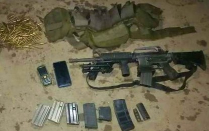 <p><strong>NEUTRALIZED.</strong> Photo shows the rifle, bandoleer, and ammunition recovered from slain Dawlah Islamiya (DI) member Adsam Indal following a brief firefight with military troops in Shariff Saydona Mustapha, Maguindanao on Wednesday (Dec. 2, 2021). The slain terrorist was the son of DI sub-leader Hassan Indal whose group is operating in the province. <em>(Photo courtesy of 6ID)</em></p>