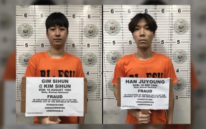 <p><strong>WANTED.</strong> Police officers arrest Han Juyong and Kim Sihun, who are both wanted for telecom fraud in South Korea, in an operation in Taguig City on Dec. 1, 2021. PNP Chief, Gen. Dionardo Carlos, said Friday (Dec. 3, 2021) the two are alleged members of a telecom fraud organization that has duped fellow South Koreans of an estimated 29 million Korean won (about PHP1.2 million). <em>(Photo courtesy of PNP PIO)</em></p>