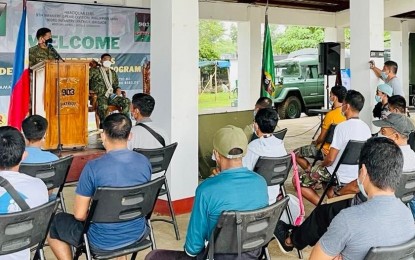 <p><strong>PEACE EFFORTS.</strong> Former rebels listen to the message of Sorsogon Police Provincial Office chief Col. Arturo Brual Jr. during the closing ceremony of a four-day deradicalization program at the 903rd Infantry Brigade camp in Barangay San Rafael, Castilla town on Thursday (Dec. 2, 2021). Brual told the 35 participants that it is never too late to restart their lives as they help the country end the long-standing problem on insurgency and terrorism<em>. (Photo courtesy of Sorsogon PPO)</em></p>