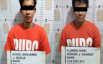 <p><strong>RAPE SUSPECTS FALL</strong>. Two suspects in the July 2018 rape of a 13-year-old girl in Butuan City are arrested by local police operatives in Purok 5 Silad, Barangay Mahogany in Butuan City on Thursday (Dec. 2, 2021). The suspects were arrested after hiding for more than three years.<em> (Photo courtesy of PRO-13)</em></p>