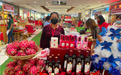 <p><strong>BUY LOCAL. </strong>Home-grown entrepreneurs like Agnes Asuncion proudly showcase their products at the <em>Partuat ni Kailokuan</em> Trade Fair in San Nicolas town, Ilocos Norte. The event runs from Dec. 3-9, 2021 at the Robinsons Mall San Nicolas activity area. (<em>PNA photo by Leilanie G. Adriano</em>) </p>