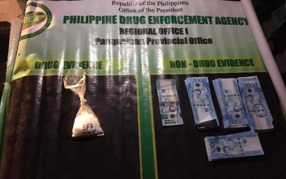 <p><strong>BUSTED.</strong> Authorities confiscate PHP340,000 worth of suspected shabu in a buy-bust operation in Barangay Caranglaan Dagupan City on Sunday (Dec. 5, 2021). The suspects identified as live-in partners Isidro Caita and Esperanza Talay were considered regional high-value targets. <em>(Photo courtesy of PDEA Pangasinan Facebook page)</em></p>