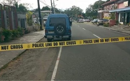 <p><strong>KILLED.</strong> Investigators put a police barricade at the area where Sarrat, Ilocos Norte councilor Apolonio Medrano was gunned down by still unidentified assailants on Monday (Dec. 6, 2021). The victim was declared dead on arrival at a nearby hospital. <em>(Contributed photo)</em></p>