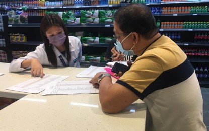 <p><strong>INTENSIFIED SURVEILLANCE</strong>. Trade and Industry Development Specialist Glen Fernando (right) conducts monitoring of Noche Buena products at Robinsons Supermarket in San Jose de Buenavista, Antique Monday (Dec. 6, 2021). Fernando said that they are now conducting weekly monitoring to make sure there is enough supply this Christmas time and that they are sold within the suggested price range. (Photo courtesy of DTI Antique)<br /><br /></p>