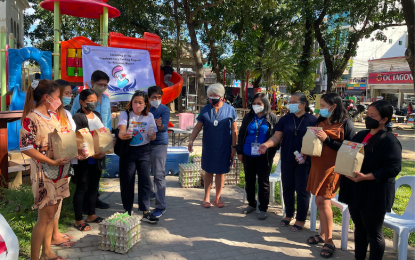 <p><strong>MILK FOR MOTHERS</strong>. The Ilocos Norte government provides chocolate milk drink for pregnant women at the launch of a supplementary feeding program in partnership with the Philippine Carabao Center and the DOST-assisted Bakers PH, producer of enhanced nutribun, on Tuesday, (Dec. 7, 2021) in Laoag City. There are 538 pregnant women in the province who will be given fresh milk, nutribun, and eggs for 90 days. <em>(PNA photo by Leilanie G. Adriano)</em></p>